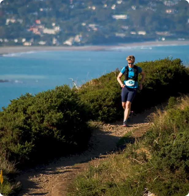 Woman running by sea