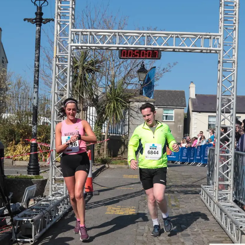 couple running over finsh line