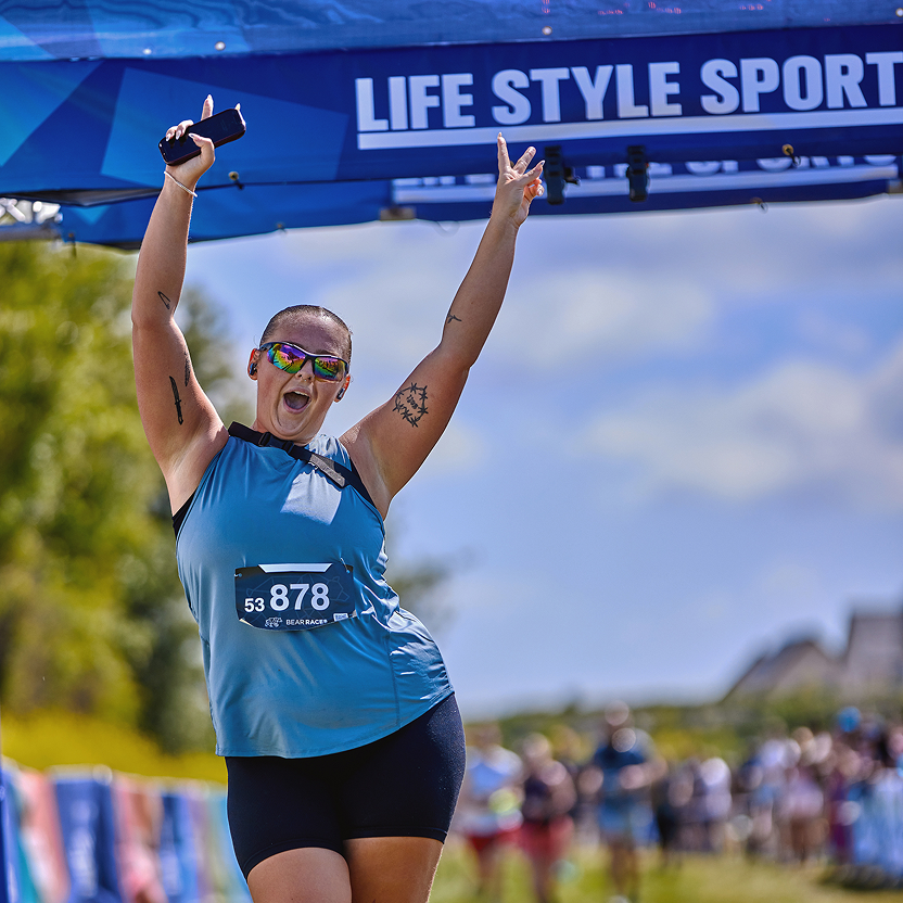 woman cheering end race